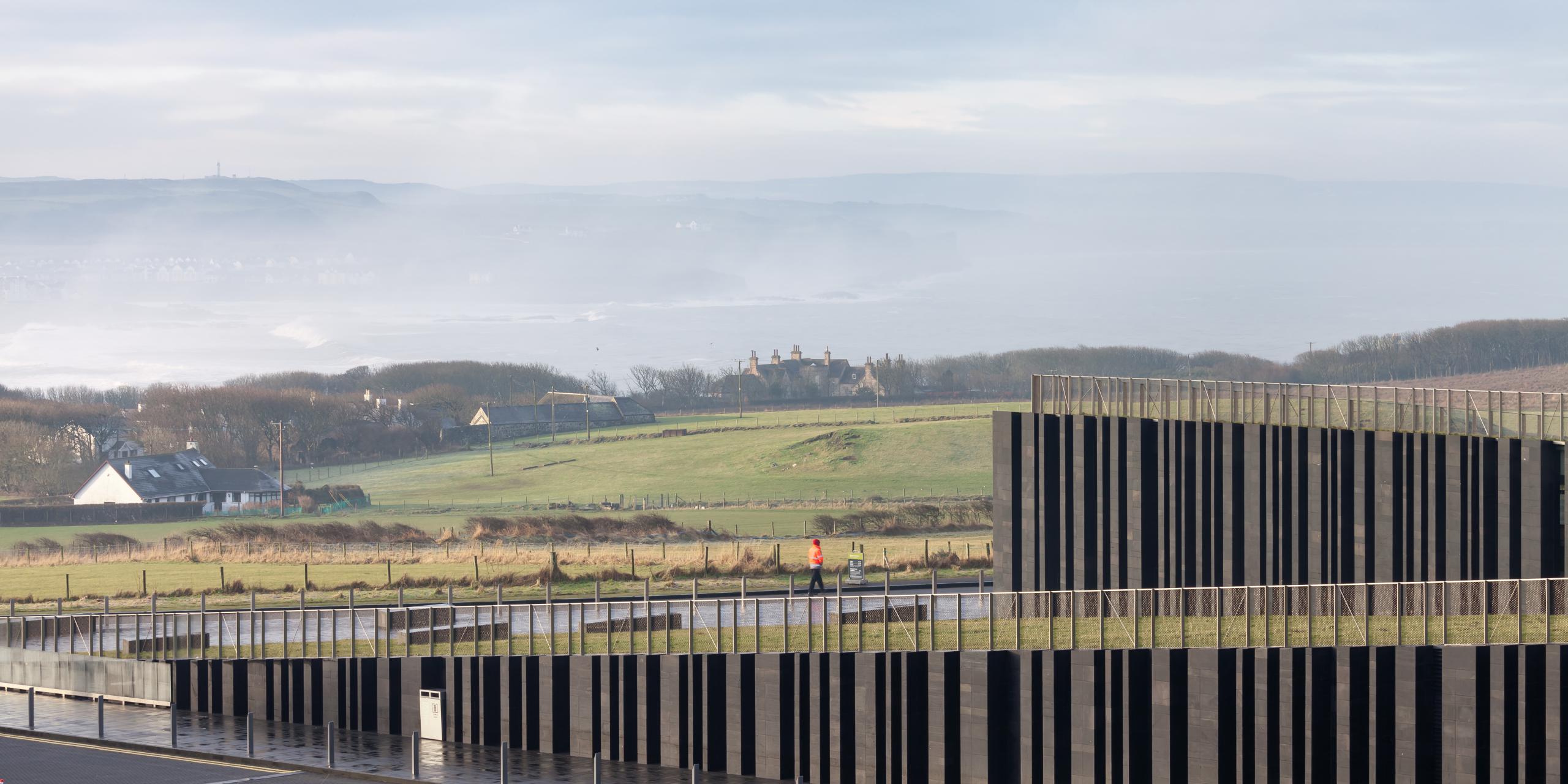 Photograph of Giants Causway Visitor Centre, designed by Heneghan Peng Architects and located in Bushmills, United Kingdom
