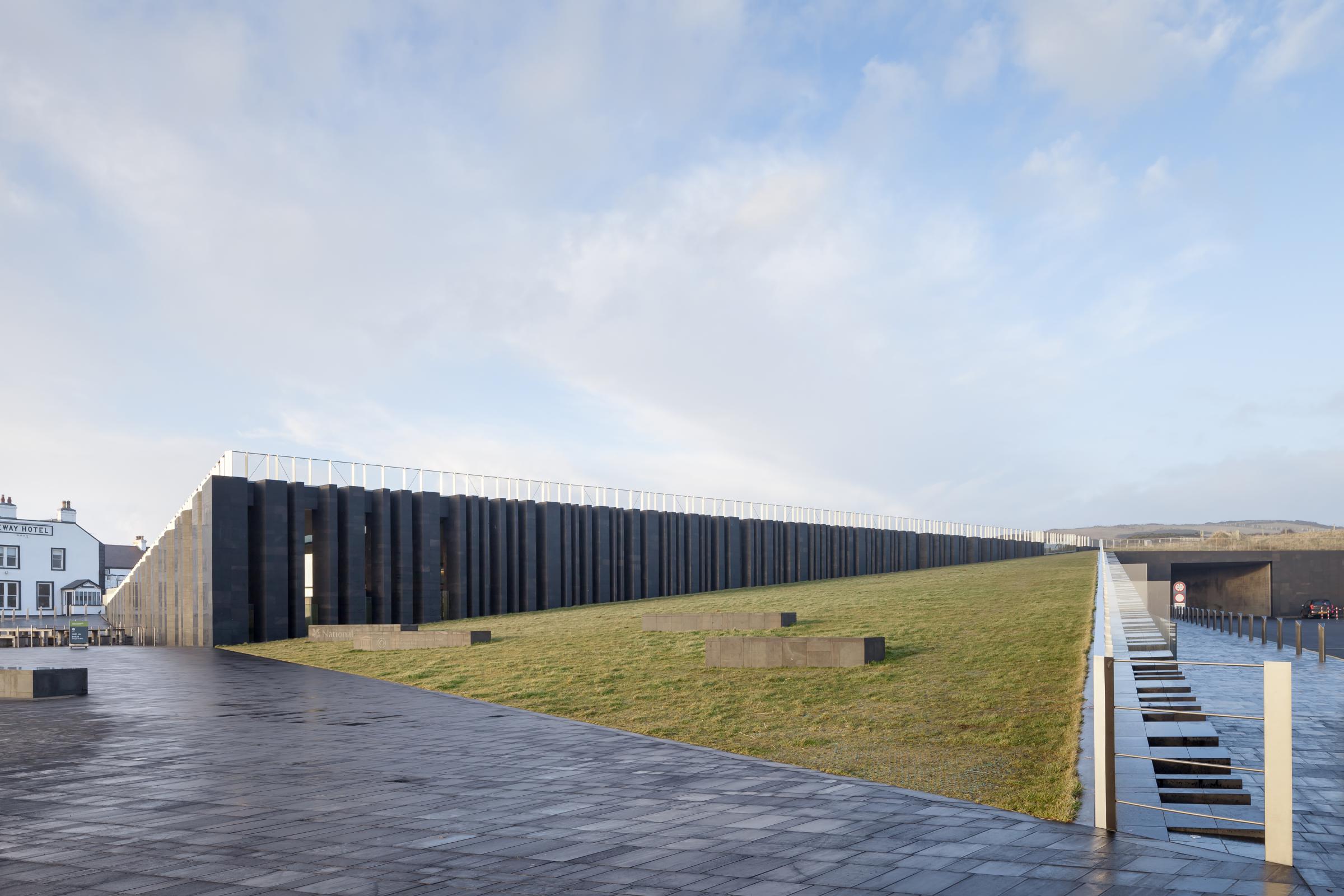 Photograph of Giants Causway Visitor Centre, designed by Heneghan Peng Architects and located in Bushmills, United Kingdom