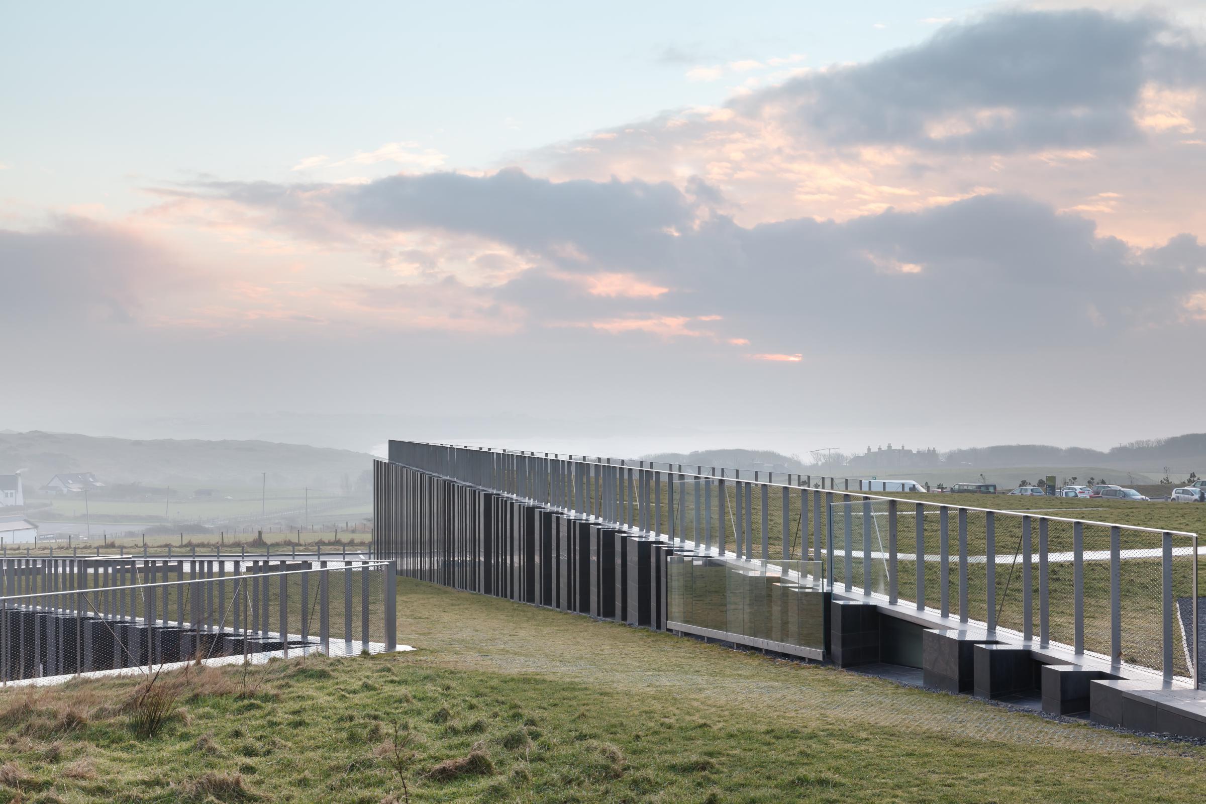 Photograph of Giants Causway Visitor Centre, designed by Heneghan Peng Architects and located in Bushmills, United Kingdom