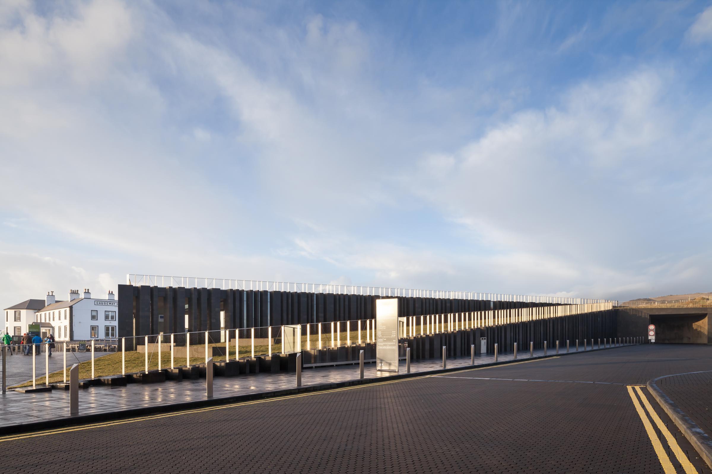 Photograph of Giants Causway Visitor Centre, designed by Heneghan Peng Architects and located in Bushmills, United Kingdom