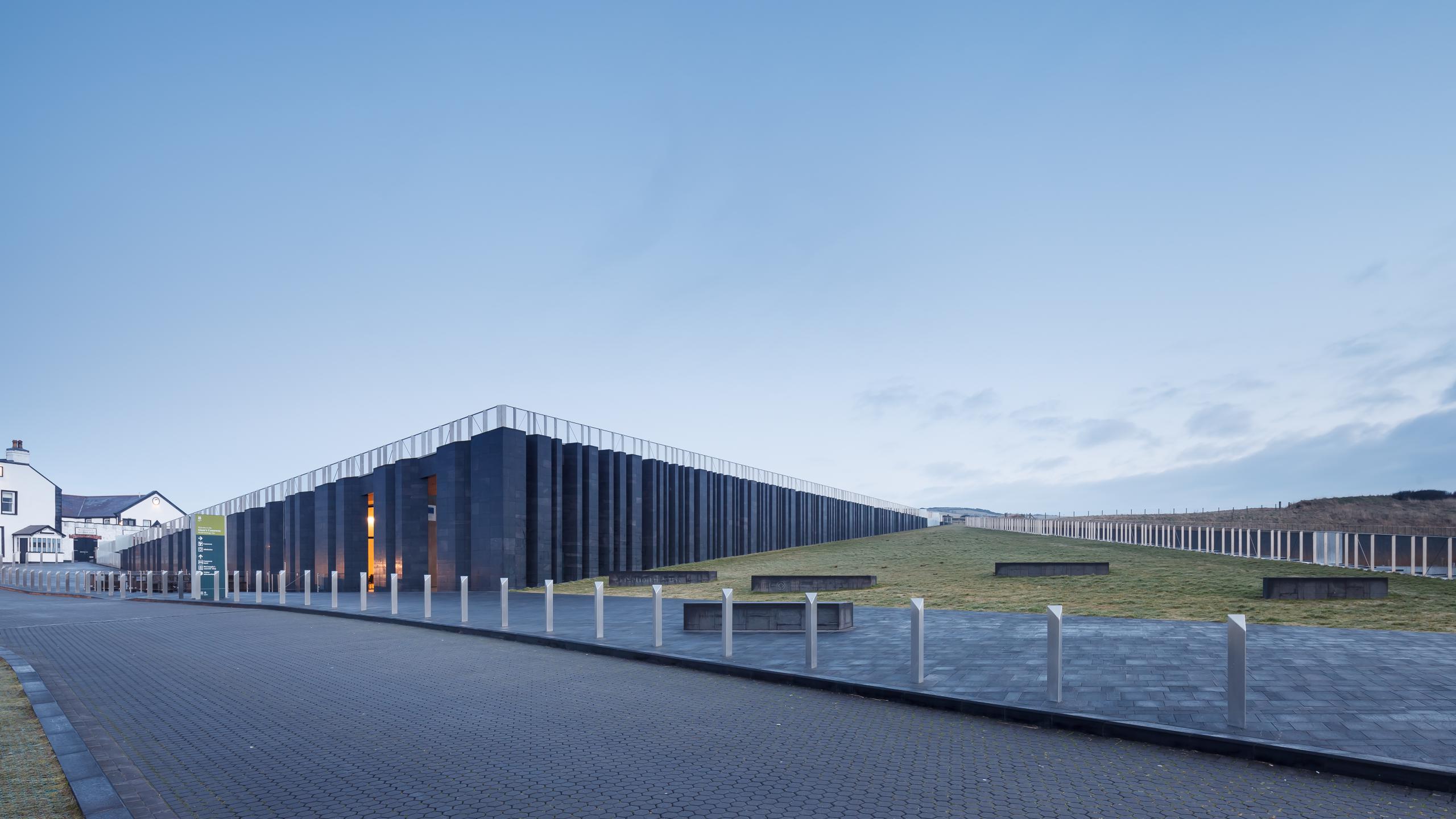 Photograph of Giants Causway Visitor Centre, designed by Heneghan Peng Architects and located in Bushmills, United Kingdom