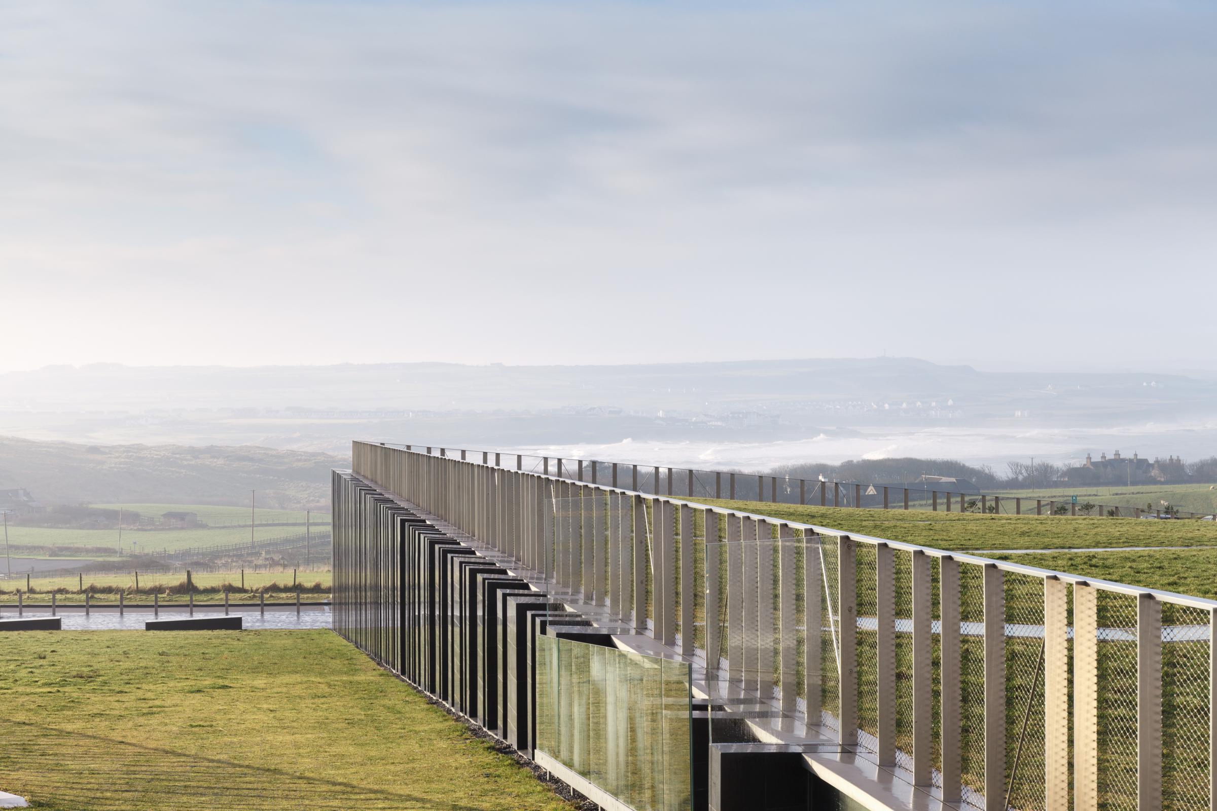 Photograph of Giants Causway Visitor Centre, designed by Heneghan Peng Architects and located in Bushmills, United Kingdom