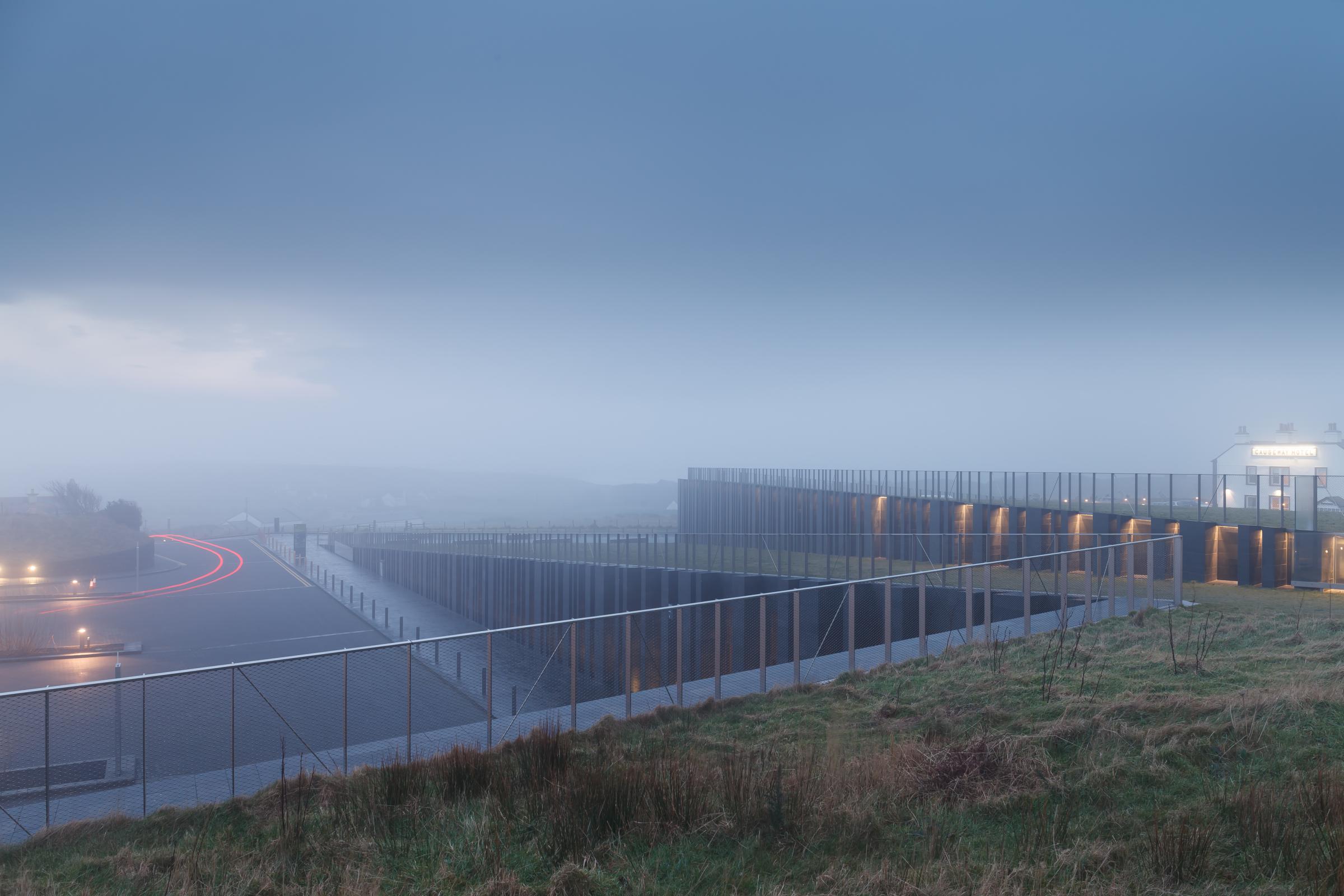 Photograph of Giants Causway Visitor Centre, designed by Heneghan Peng Architects and located in Bushmills, United Kingdom