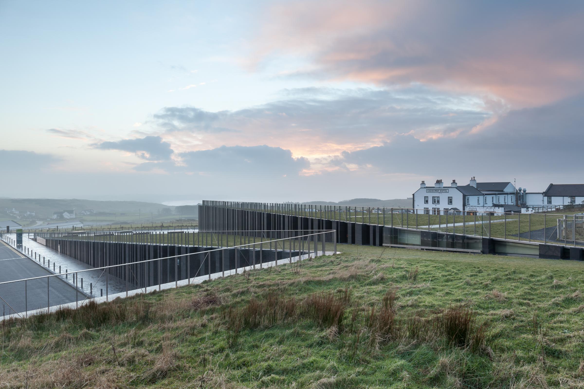 Photograph of Giants Causway Visitor Centre, designed by Heneghan Peng Architects and located in Bushmills, United Kingdom